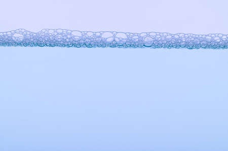 Light blue bubbles and water White backgroundの写真素材