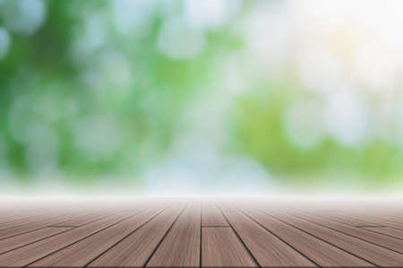 Wood floor scene backdrop Green bokeh blur with sun beamの写真素材