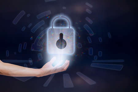 Digital symbol lock key on handの写真素材