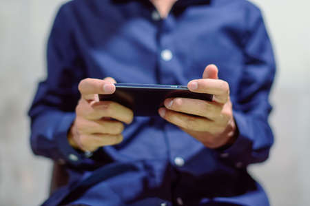 Business people use smartphones and play smart phonesの写真素材