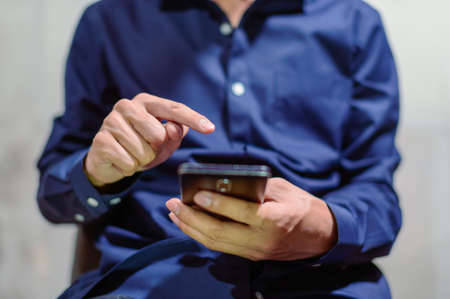 Business people use smartphones and play smart phonesの写真素材