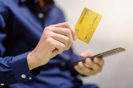 Business people use credit cards via smartphone to shop and do business in tradingの写真素材