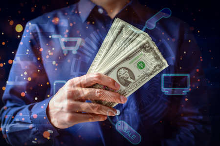 Business people show graphics using money to buy and sell productsの写真素材