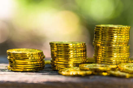 Saving money concept and save money to support everything in life with sun light bokeh backgroundの写真素材