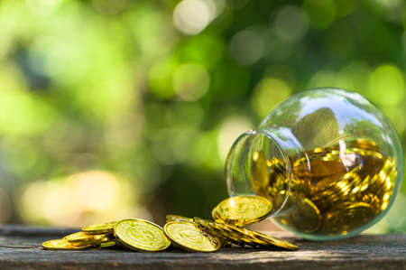 Saving money concept and save money to support everything in life with sun light bokeh backgroundの写真素材