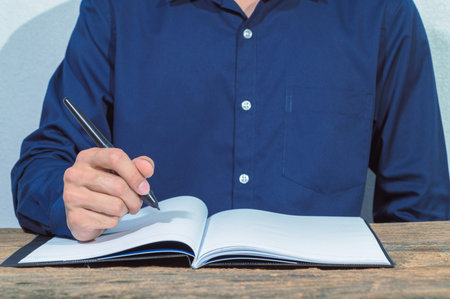 The business man checks the accounts and documents on the table
