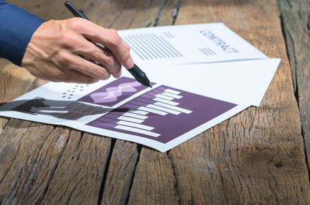 Employee checking business growth bar graph documentの写真素材