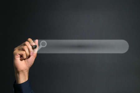 The pen holding hand is pointing at the digital search box.の写真素材