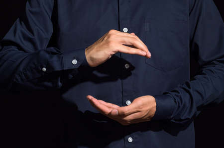 Human hands carry gestures in blue clothesの写真素材