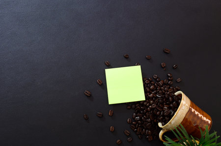 Note paper and coffee beans on the desk, top view