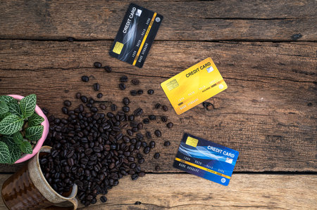 Credit cards and coffee beans on the desk top view