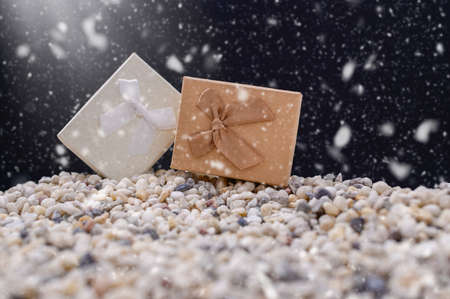 Merry christmas gift box snowy night backgroundの写真素材