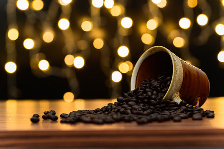 Coffee beans On the desk Orange bokeh lights backdrop
