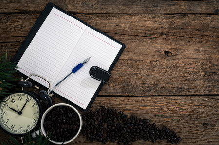 Notebook and coffee At the desk, top view