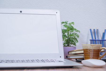 notebook computer was placed at the desk in the room