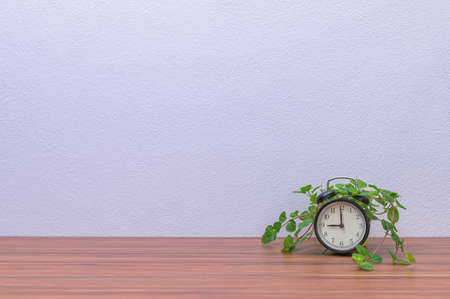 clock and tree are atr deskの写真素材