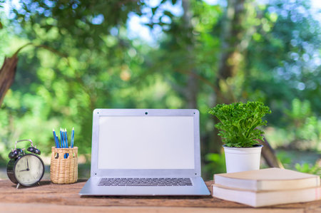 Notebook computer And stationary equipment At the desk, natural view