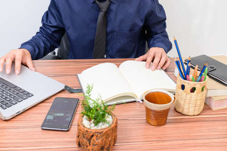 Business people work through notebook computers At the desk in the roomの写真素材