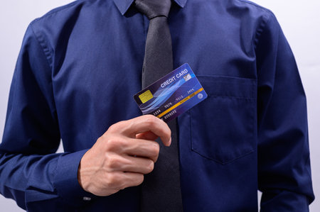 Business people hold credit cardsの写真素材