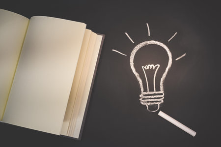 Read a book concept light bulb symbol on the blackboard represents an idea