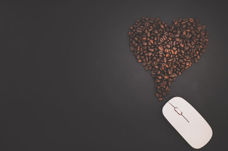 Coffee love concept The computer mouse and coffee beans form heart shapes that represent energy of...