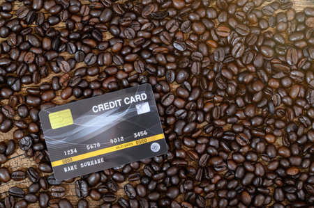 A credit card placed on a coffee beanの写真素材