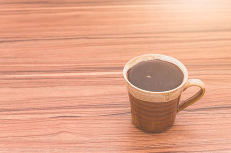 concept of drinking coffee Coffee beans and coffee cups are on the tableの写真素材