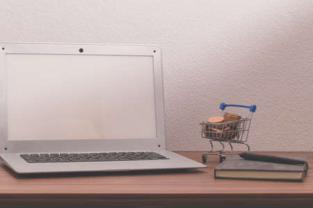 Notebook computers and books are on the desk.の写真素材