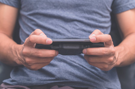 Human beings play games through smartphonesの写真素材