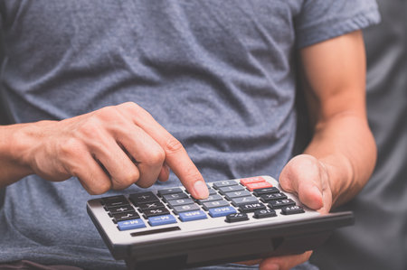 A human using a calculatorの写真素材