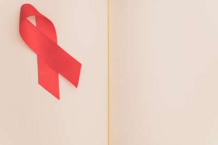 Red ribbon symbolizes world health dayの写真素材