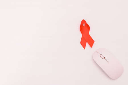 Red ribbon symbolizes world health dayの写真素材