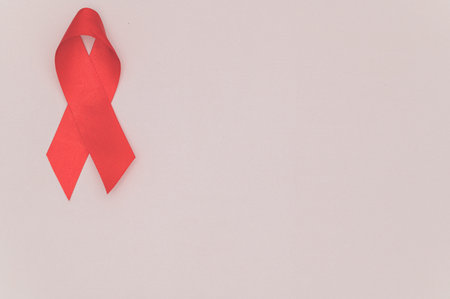 Red ribbon symbolizes world health dayの写真素材