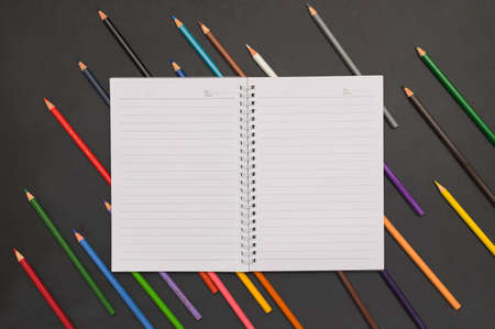 Book and colored pencils Back to school and education conceptの写真素材