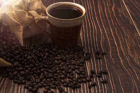 Love drinking coffee, coffee mugs and coffee beans on the tableの写真素材