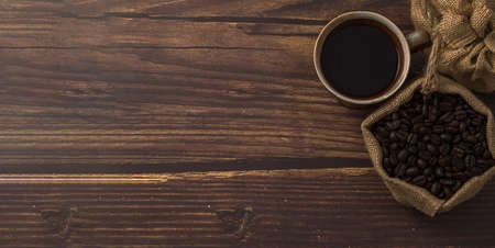 Love drinking coffee, coffee mugs and coffee beans on the tableの写真素材