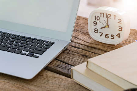 The notebook computer is on the deskの写真素材