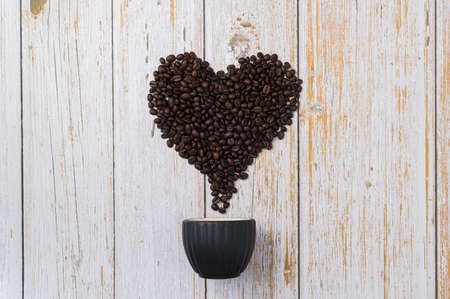 Coffee beans arranged in a heart shape.Love drinking coffeeの写真素材