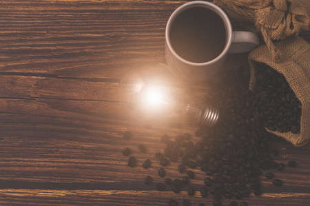 Love drinking coffee, Coffee cup light bulb emitting energyの写真素材