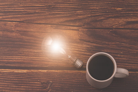 Love drinking coffee, Coffee cup light bulb emitting energyの写真素材