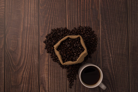 Coffee beans arranged in a heart shape.Love drinking coffeeの写真素材