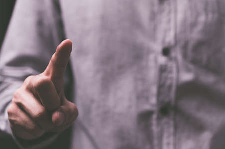 People standing with fingers touch screenの写真素材