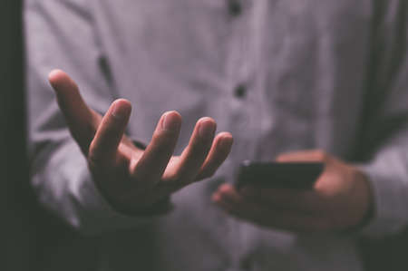 People pretending to spread their hands to hold thingsの写真素材