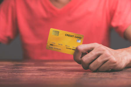 Business people hold credit cardsの写真素材