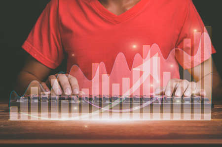 Concept of business investor working in the online world showing hologram graphicsの写真素材