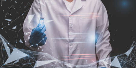 doctor holds a bottle of vaccine medicineの写真素材