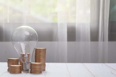 coins stacked together investment ideas stocks financial growth light bulb ideas