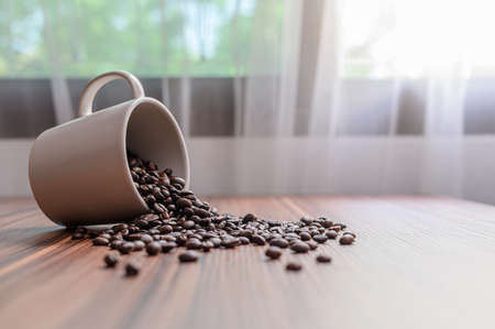 Coffee mugs and coffee beans to boost energyの写真素材
