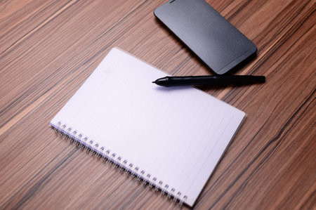 The book is at the desk.