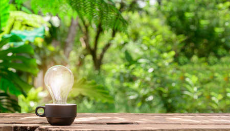 Concept Idea Light Bulb Emitting Bokeh Backgroundの写真素材